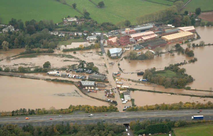 Aerial photo showing flooding of the railway line at Hele in 2012