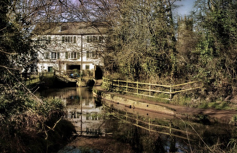 Colour photograph of Lower Mill Cullompton with the River Culm running through it.