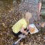 Child river dipping in the river Culm