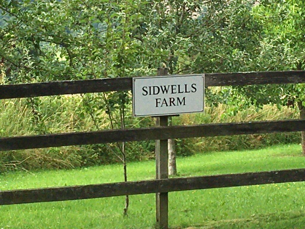 Sidwells Farm sign on some wooden hurdles.