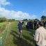 Tim Youngs, Blackdown Hills National Landscape manager and part of the Connecting the Culm talking to a groups of graduates in a field on the Culm catchment.